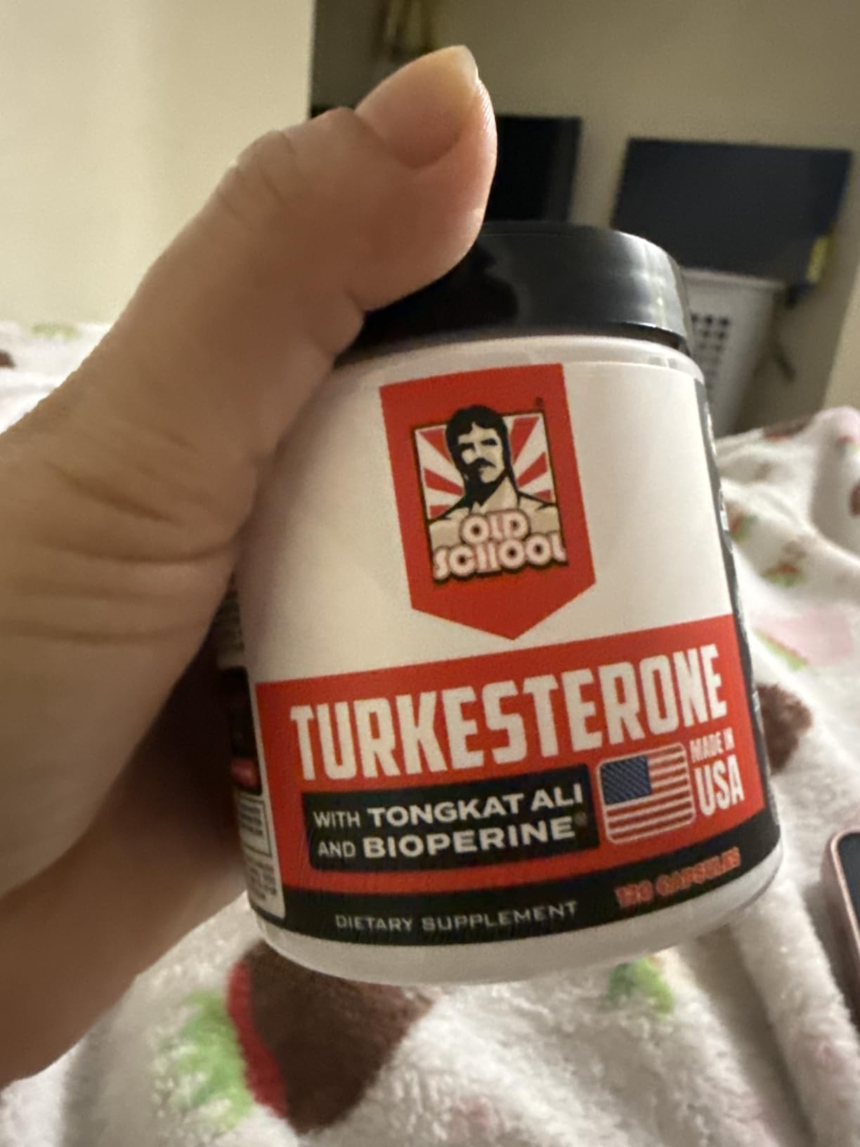 Customer holding a jar of Old School Labs Turkesterone with Tongkat Ali and BioPerine, 120 capsules, made in USA